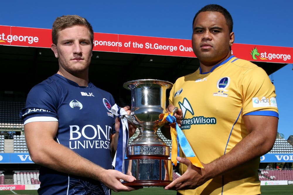 Queensland Country captain James Tuttle and Brisbane City captain Sam Talakai with the Andy Purcell Cup. Photo: Brendan Hertel
