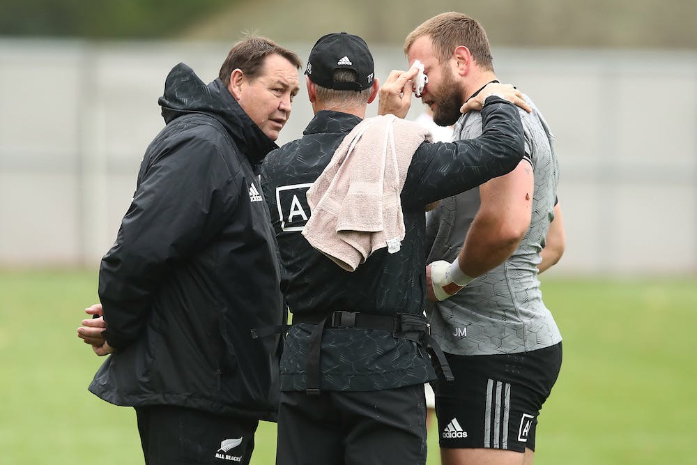 Joe Moody attended by a doctor and All Blacks coach Steve Hansen. Photo: Getty Images