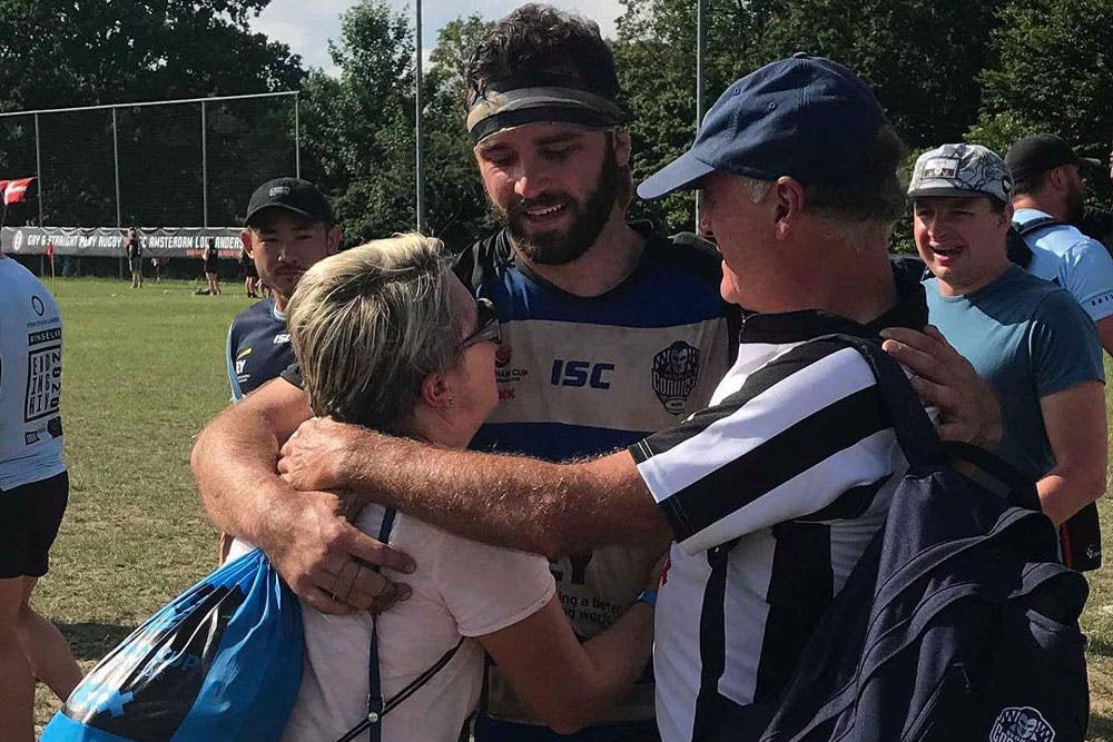 Sydney Convicts player Lachlan McGregor with his parents, after winning the Bingham Cup. Photo: Supplied