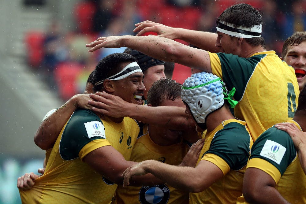 Shambeckler Vui was mobbed by teammates after his spectacular try. Photo: Getty Images