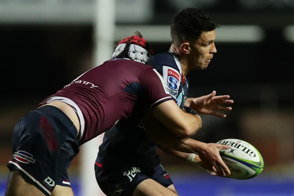 Rebels Captain, Matt To'omua is tackled by Fraser McReight. Photo:Getty Images