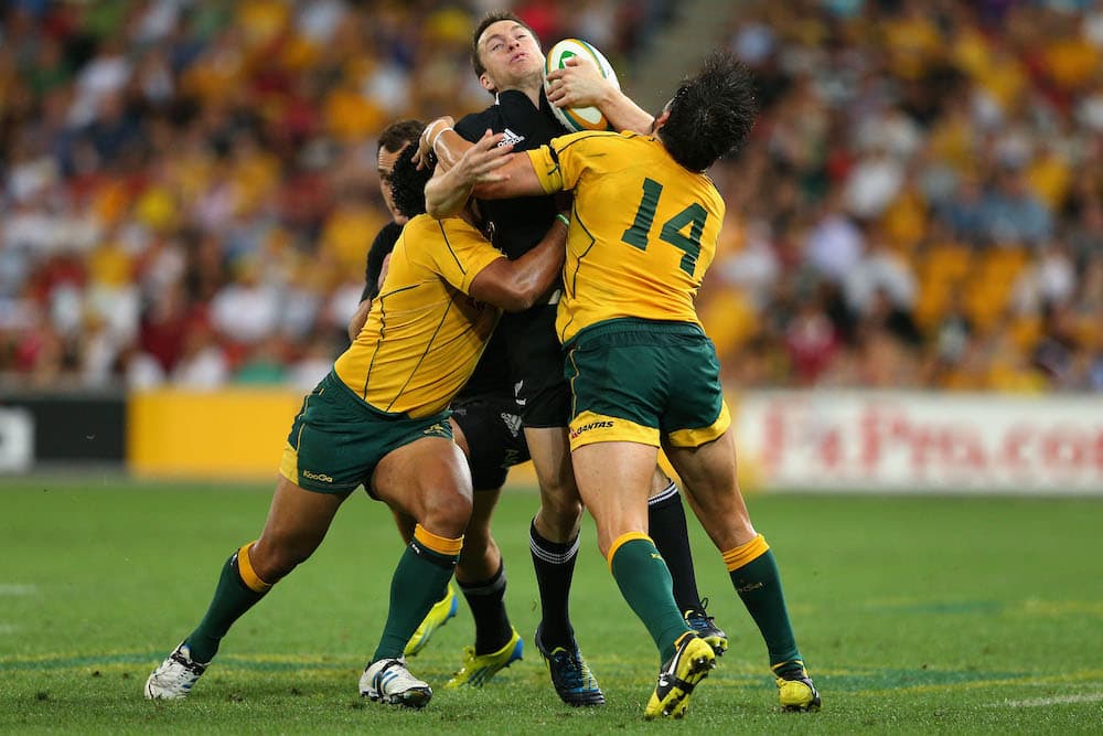 Wallabies Ben Tapuai and Adam Ashely-Cooper jam Ben Smith in the Wallabies draw against the All Blacks in 2012, ending their world record chances. Photo: Getty Images
