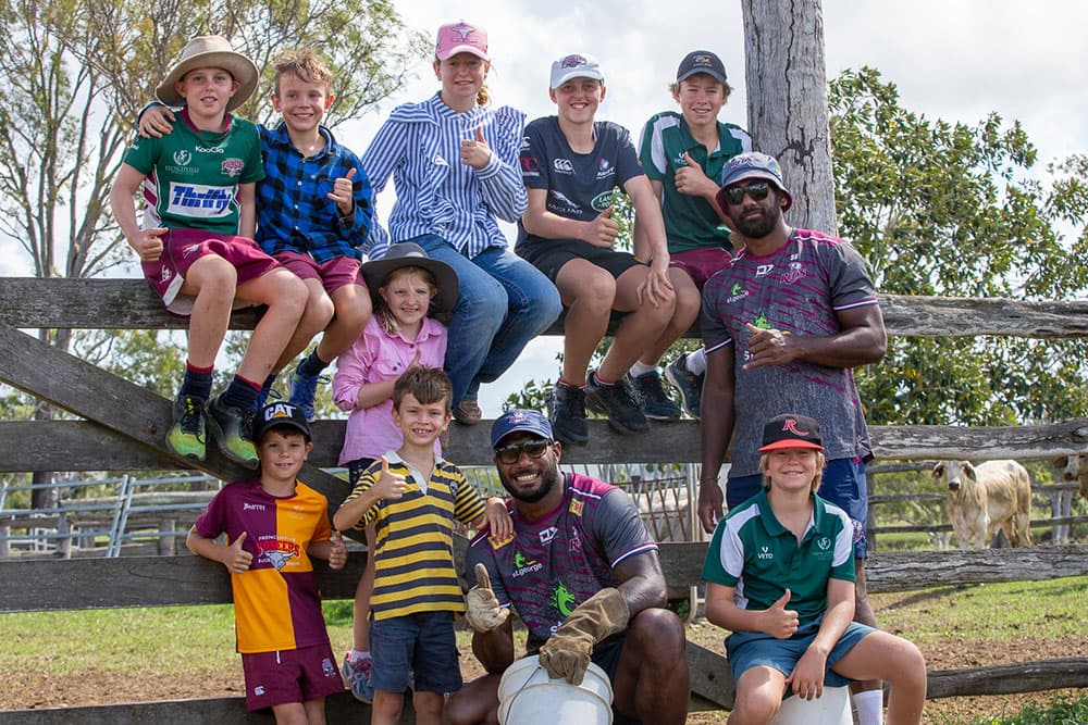 Suliasi Vunivalu and Seru Uru with their billet family's children on a farm in Rockhampton. Photo: Tom Mitchell/QRU