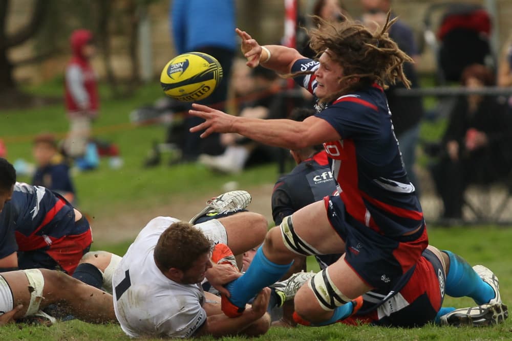 Jordy Reid gets an offload away despite the attention of Wallabies prop James Slipper. Photo: ARU Media/Stu Walmsley