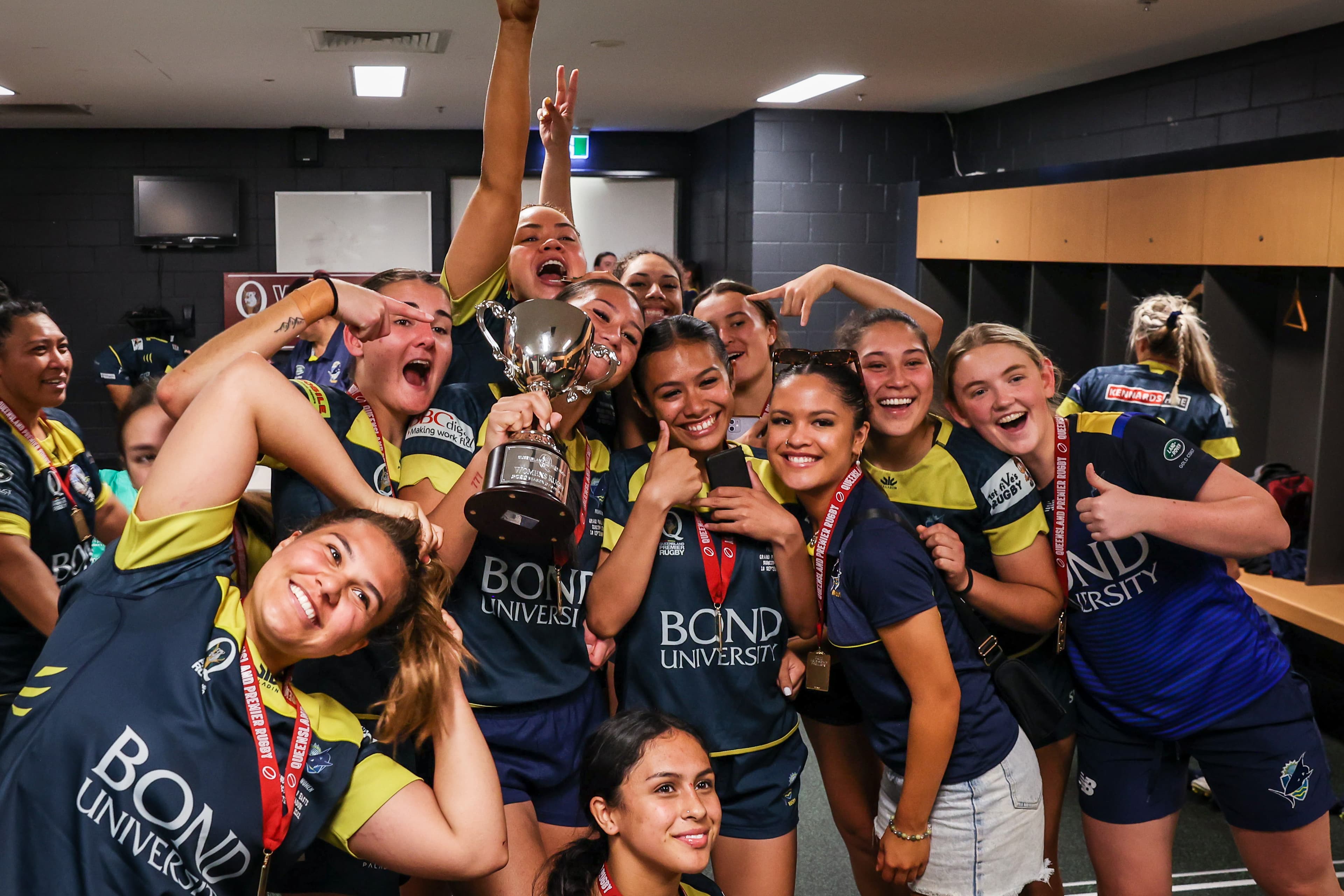 Bond University celebrate their women's grand final success at Suncorp Stadium in 2022. Photo: Brendan Hertel, QRU