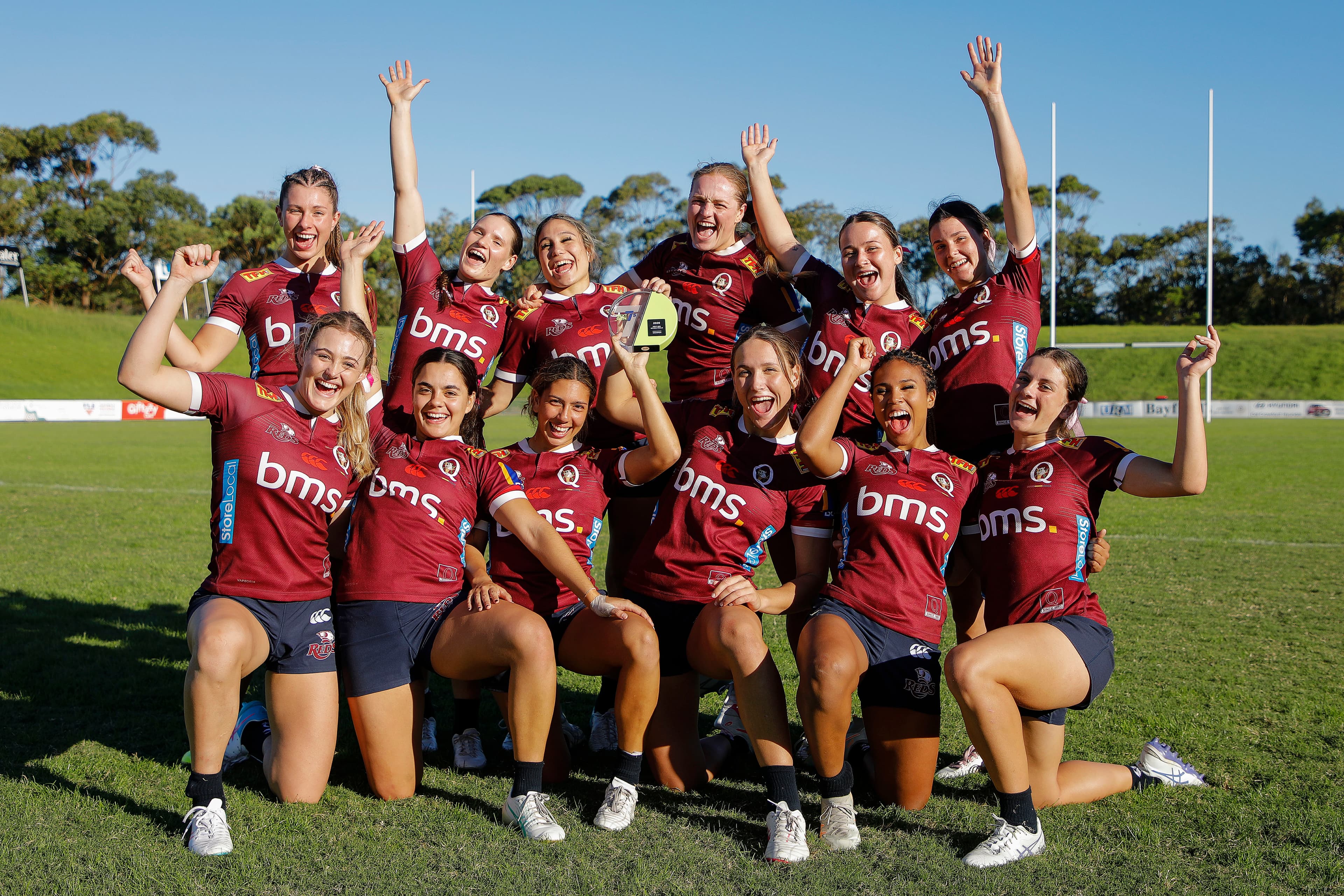 Queensland's Next Gen 7s girls celebrate their trophy win in Sydney today. Photo: Karen Watson