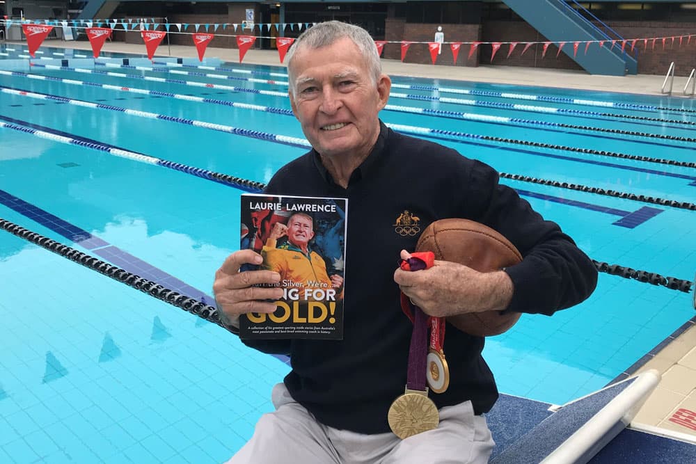 Lawrence poses with his new book. Photo: Jim Tucker