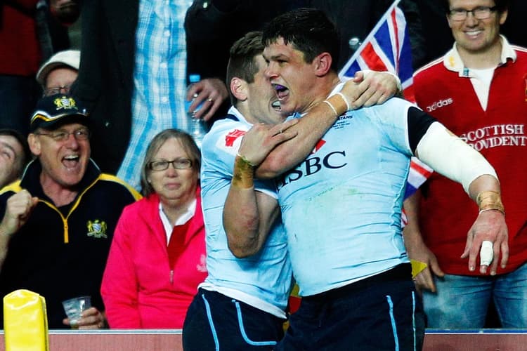 Tom Carter celebrates a try against the British & Irish Lions. Photo: Getty Images