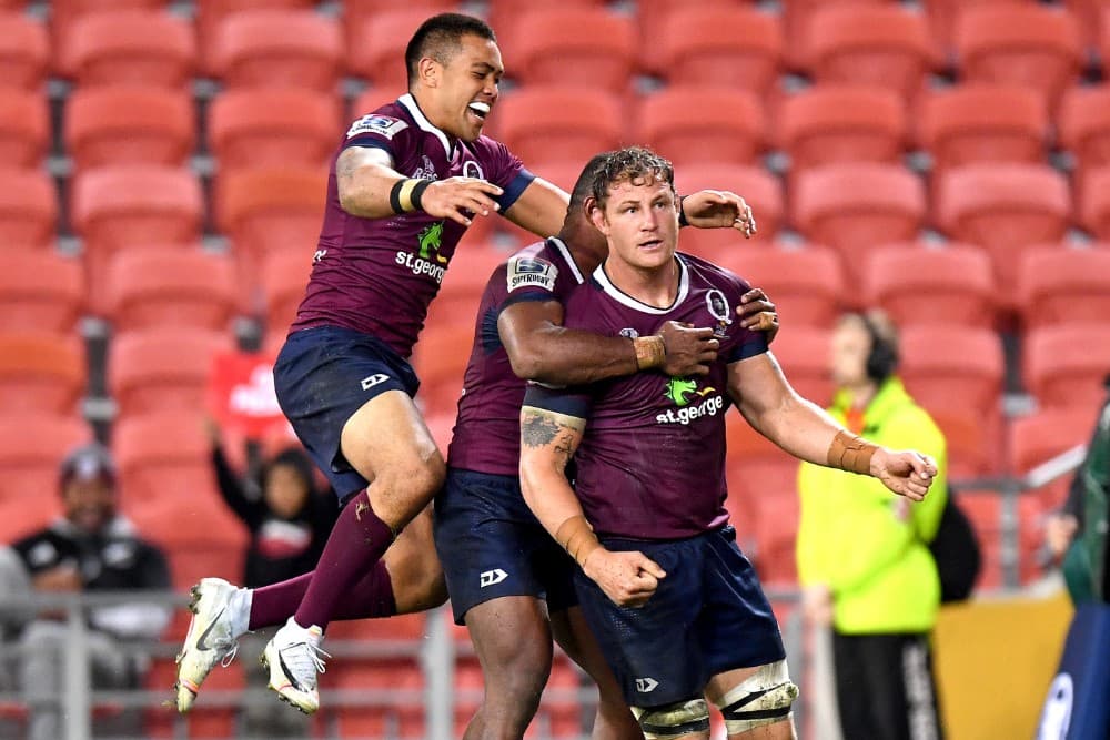 Scott Higginbotham celebrates the Reds' drought-breaking win in his final home match. Photo: Getty Images