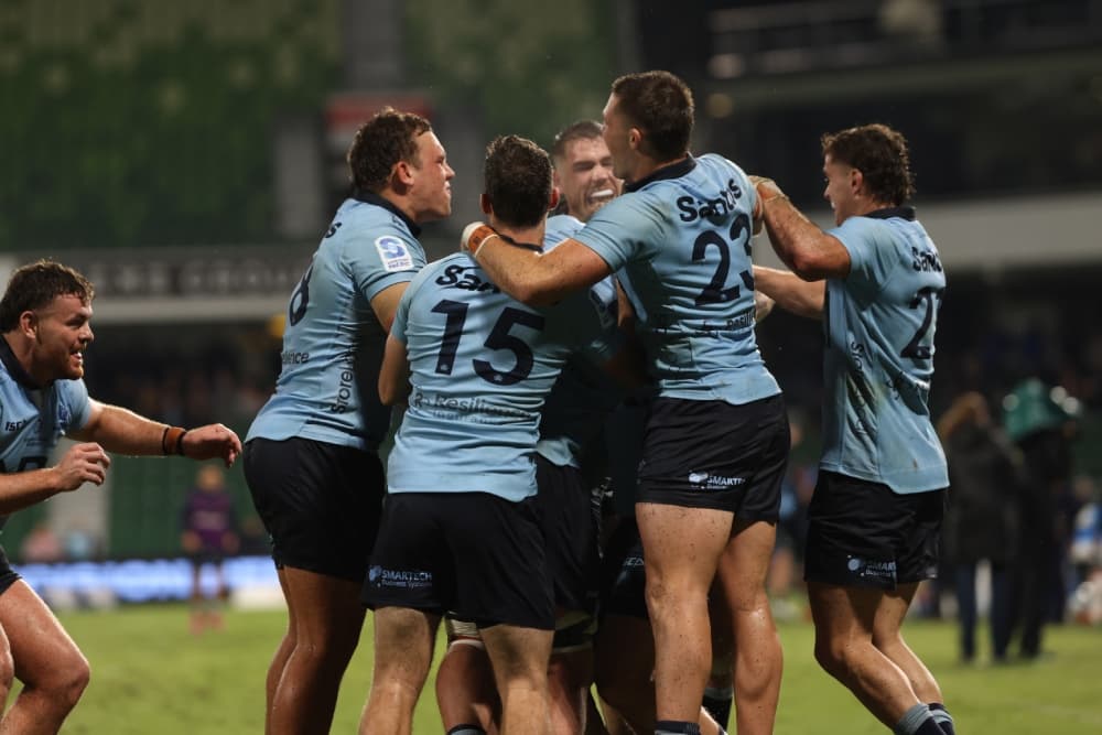 The NSW Waratahs celebrate a last minute winner against the Force. Photo: Getty Images