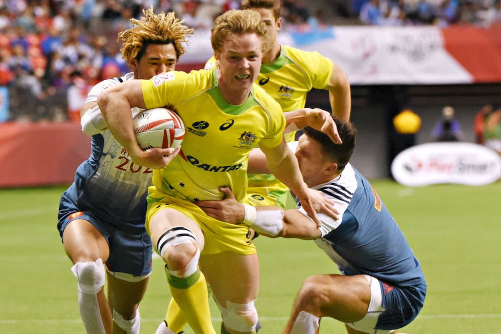 Henry Hutchison fighting hard against France at BC Place Stadium, Vancouver. Photo: AFP