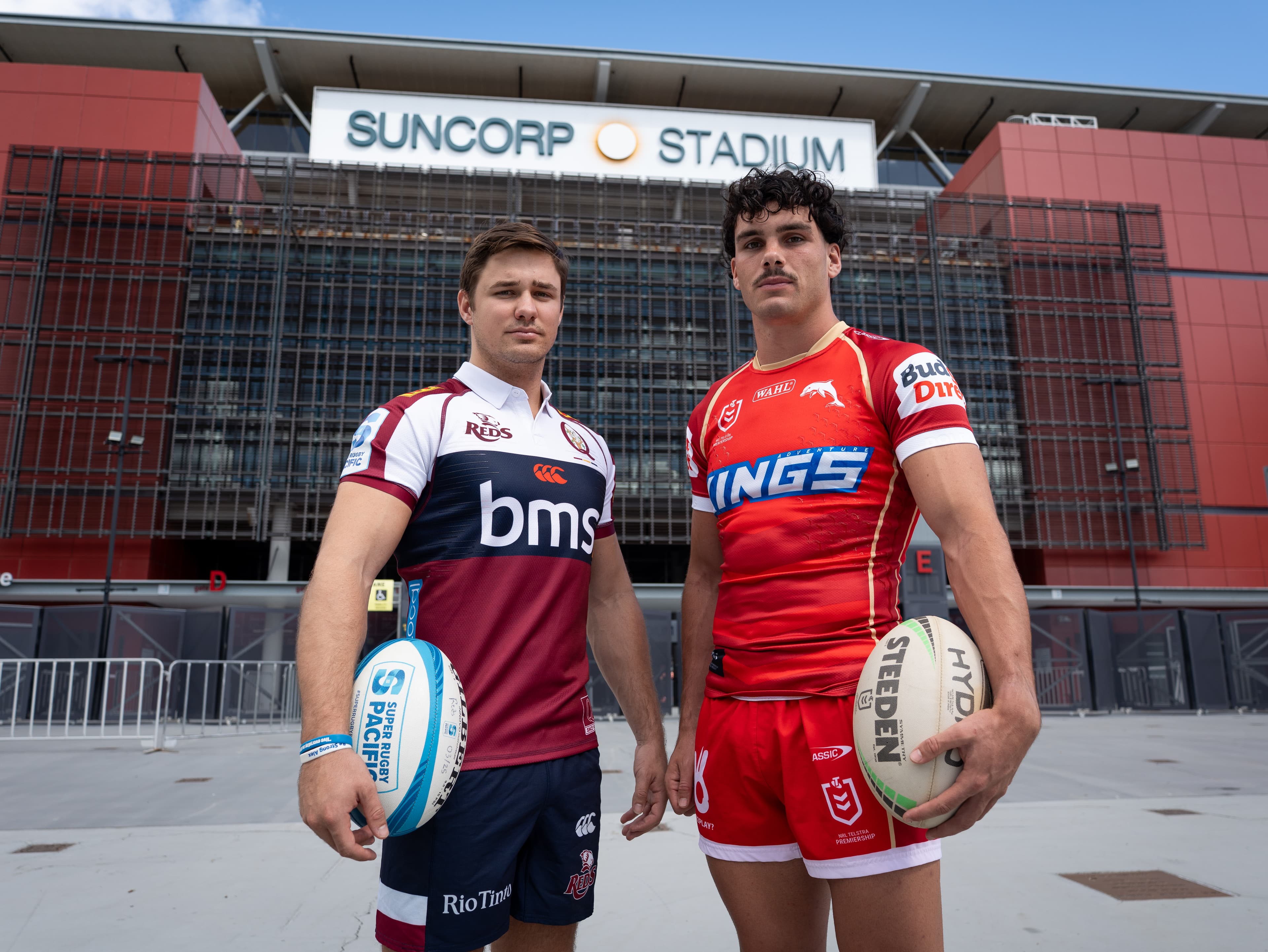 Josh Flook (Reds) and Herbie Farnworth (Dolphins) team up at Suncorp Stadium for the school holiday two-for-one ticket offer for fans. Photo: Neha Kumar