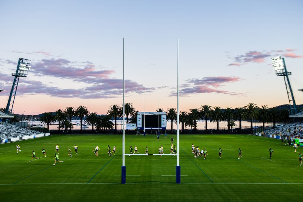 The sun hits cloud over Brisbane Water at the southern end of Central Coast Stadium late during Thursday’s training. Photo: ARU Media/Stuart Walmsley