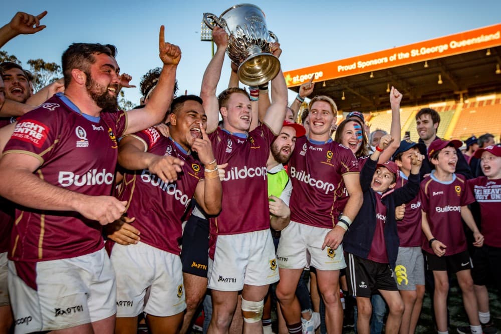 UQ captain James Dalgleish lifts the Hospital Cup trophy. Photo: QRU Media/Brendan Herte