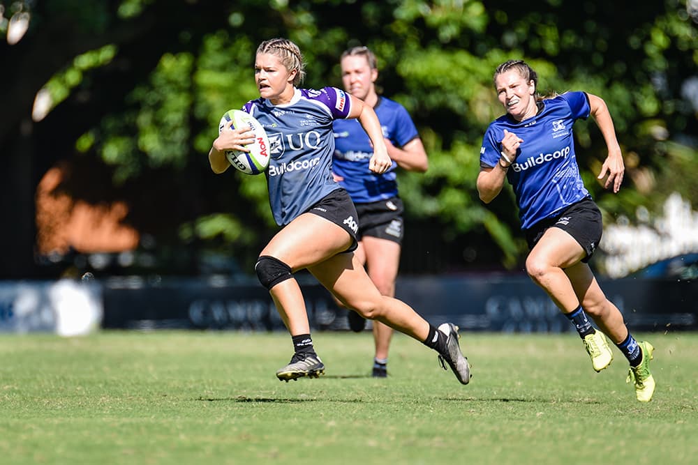 University of Queensland player beats the Melbourne Defence | Stephen Tremain
