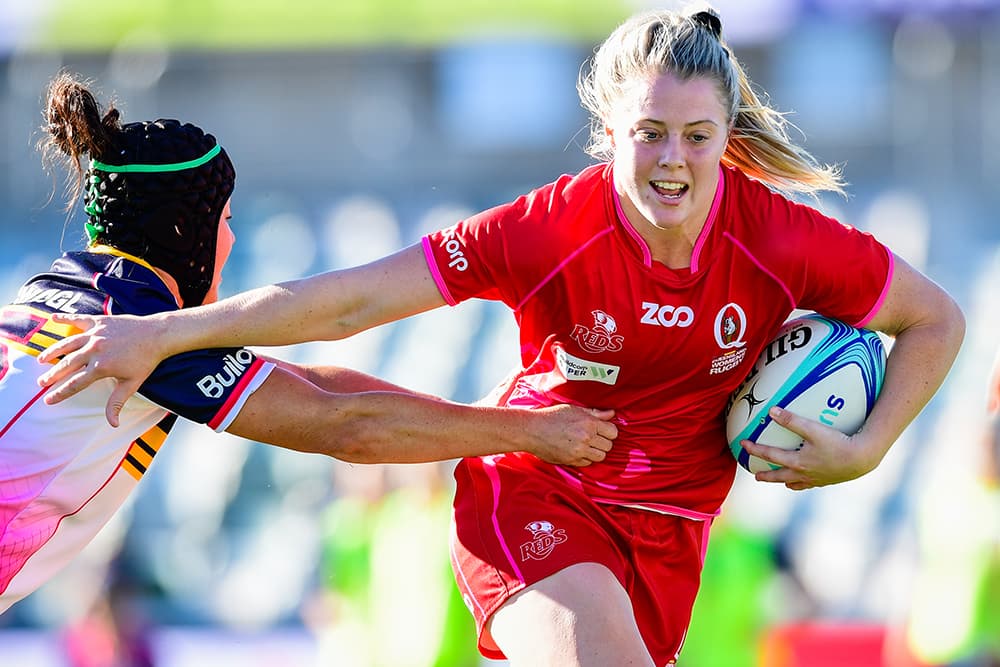 Michelle Perry of the Brumbies tackles Queensland’s Sammie Treherne at GIO Stadium on Saturday. Photo: RUGBY.com.au/Stuart Walmsley