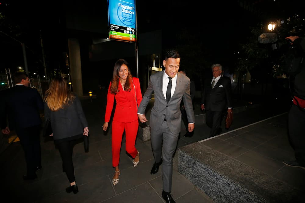 Israel Folau leaves the mediation hearing in Melbourne with wife Maria. Photo: Getty Images 
