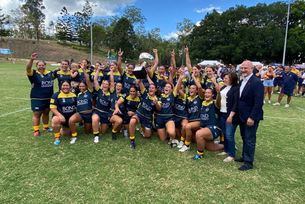 Celebration time...Bond University hold aloft the Sukkar Cup after their Australian Club Championship success and share it with Josephine and Tony Sukkar.