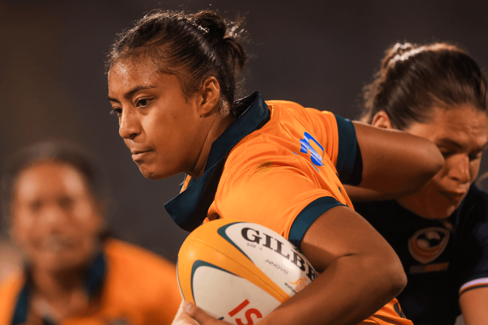 Faitala Moleka palms off Ilona Maher during the Wallaroos clash with the USA in Canberra (Source: Getty)