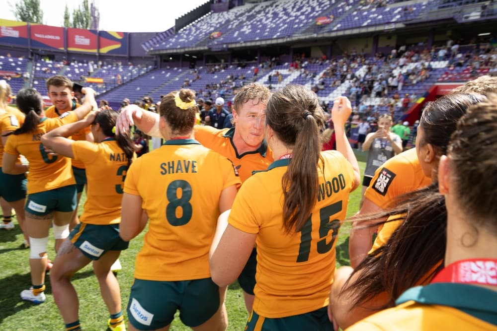 Australia Sevens sides congratulating each other after their titles in Spain. Photo: World Rugby