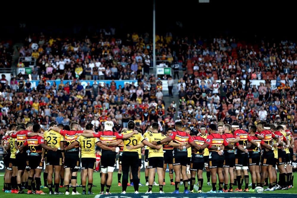 The Chiefs and Hurricanes joined together in a pre-match huddle. Photo: Getty Images