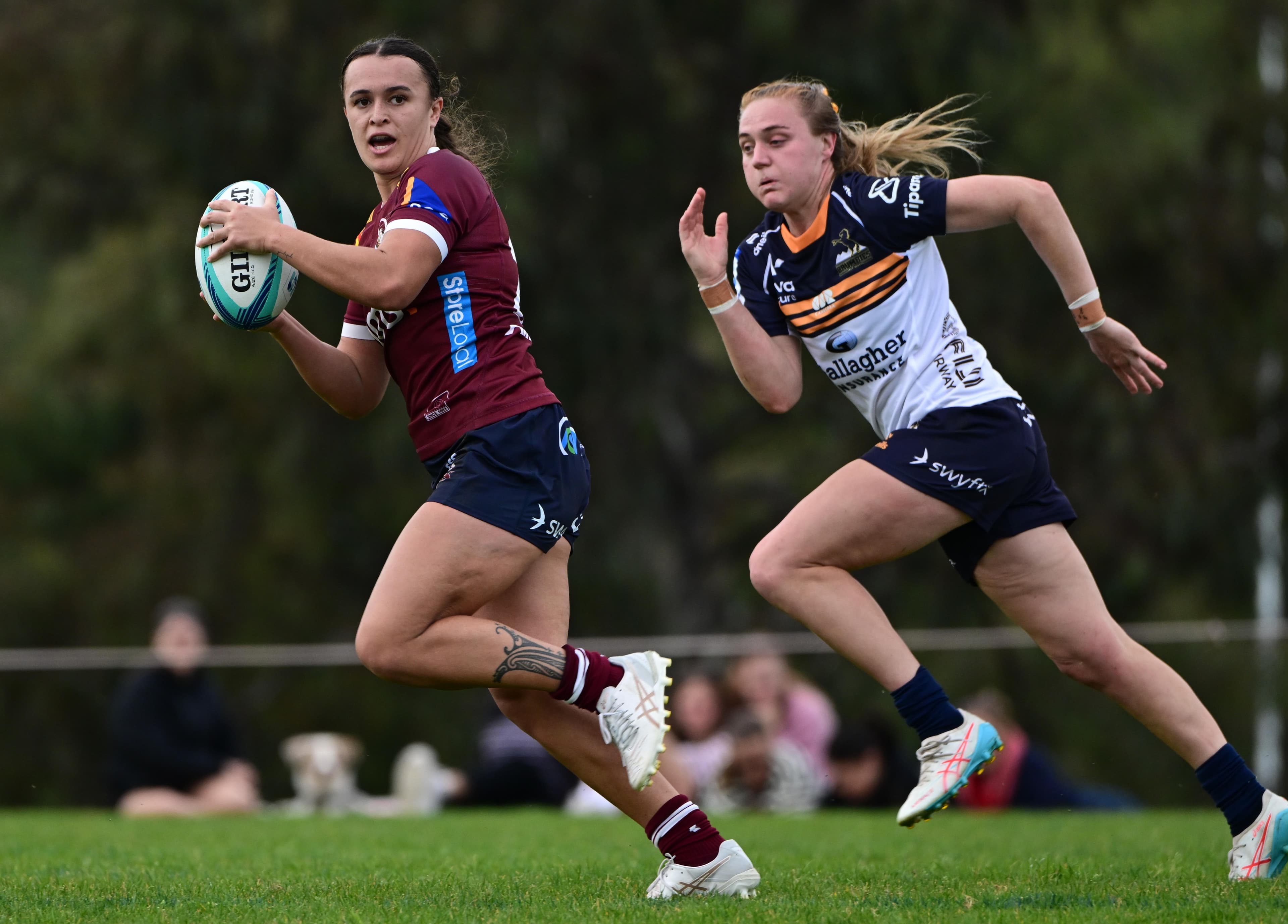 Reds centre Ava Wereta on the charge against the Brumbies in Saturday's trial. Photo: Brumbies Media