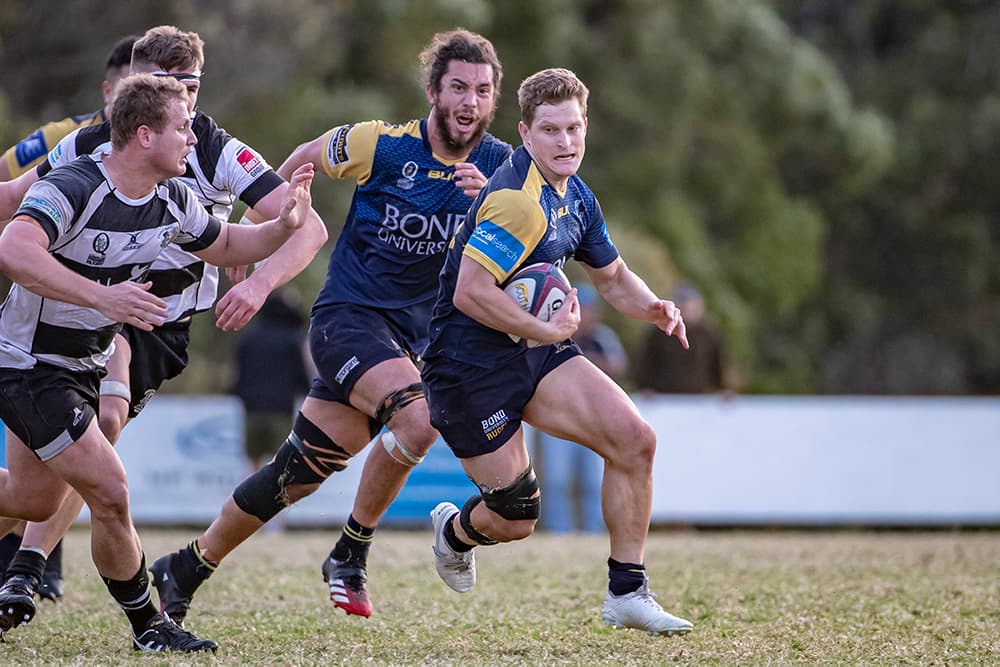 Centre and captain Dan Boardman in action for Bond University. Photo: Brendan Hertel