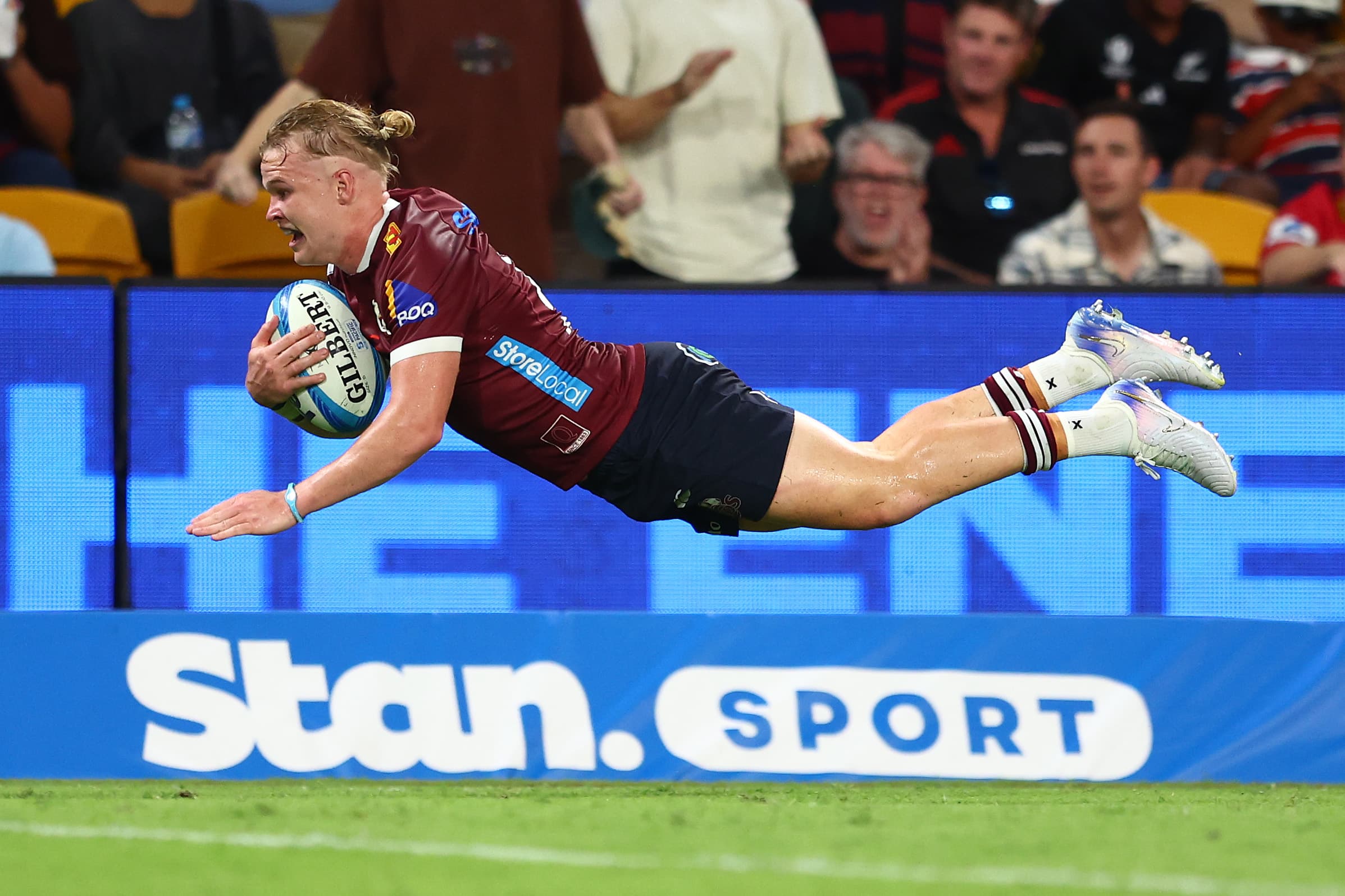 Try-time...Louis Werchon dives over for the match-clinching try at Suncorp Stadium. Photo: Chris Hyde, Getty Images