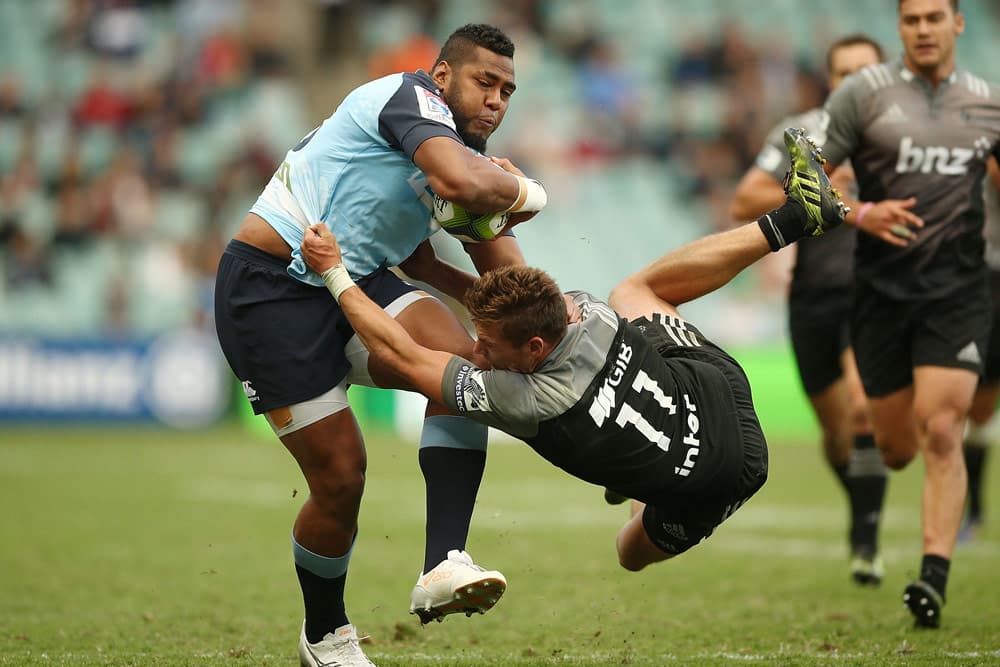 Taqele Naiyaravoro fended off George Bridge. Photo: Getty Images"