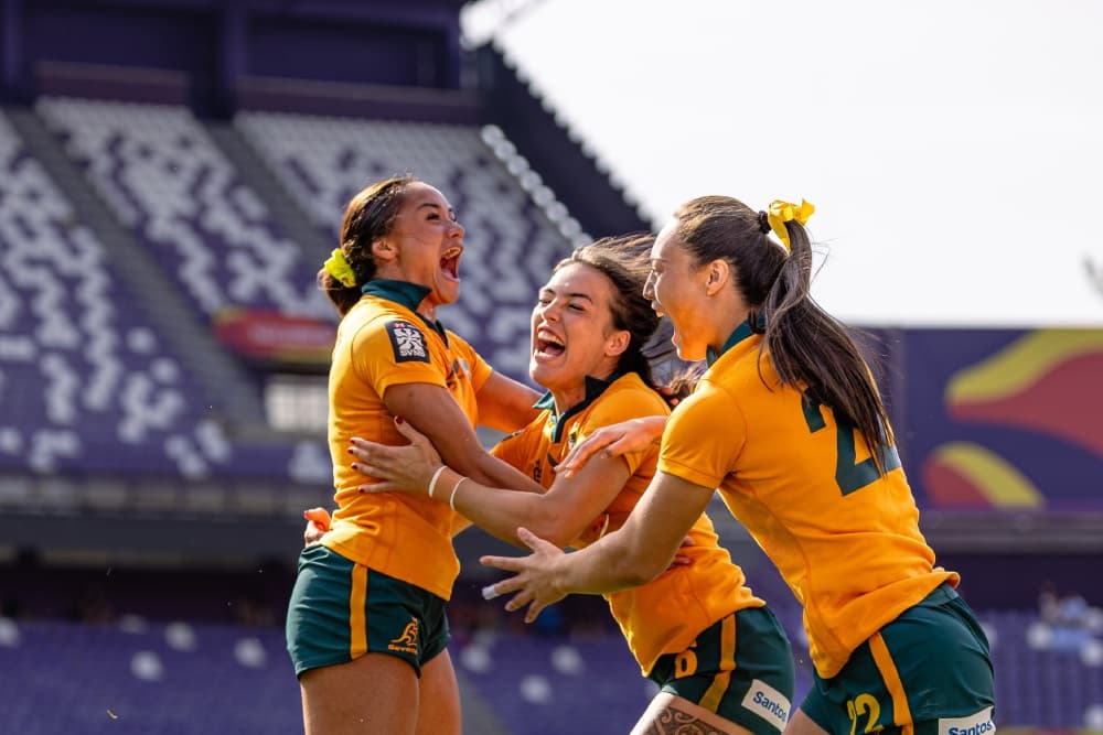 Australia celebrates their Spanish title success after their win over the USA. Photo: World Rugby