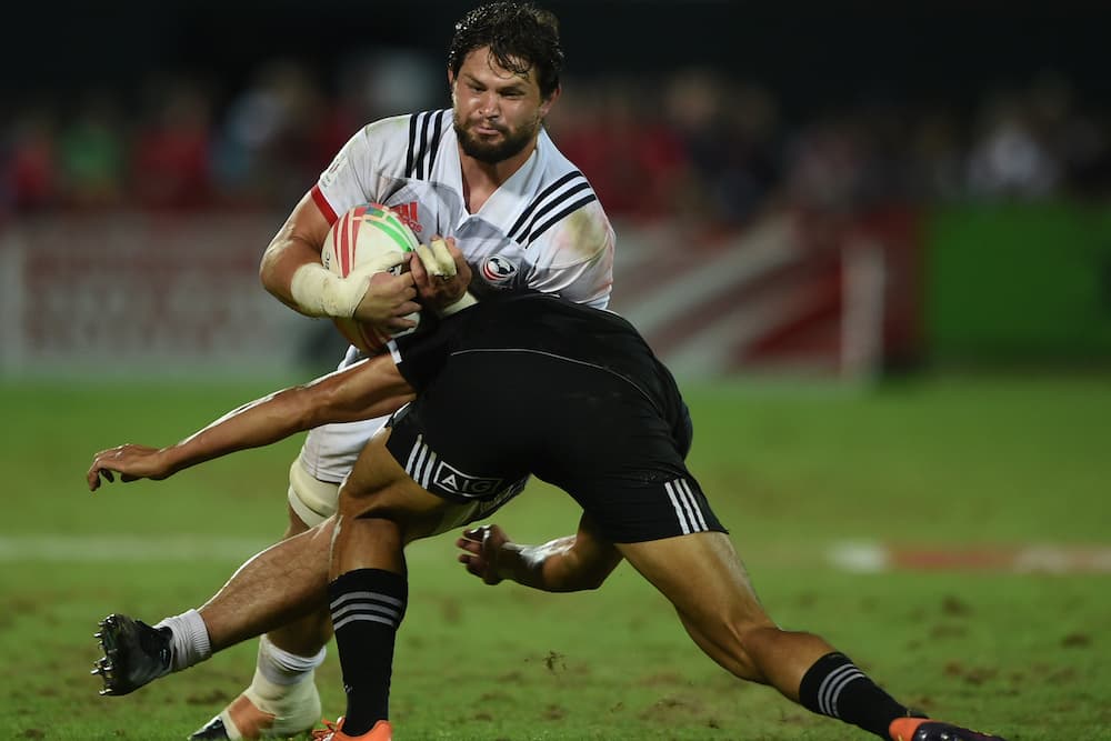 USA Sevens star Danny Barrett runs over the top of a New Zealander defender. Photo: Getty Images