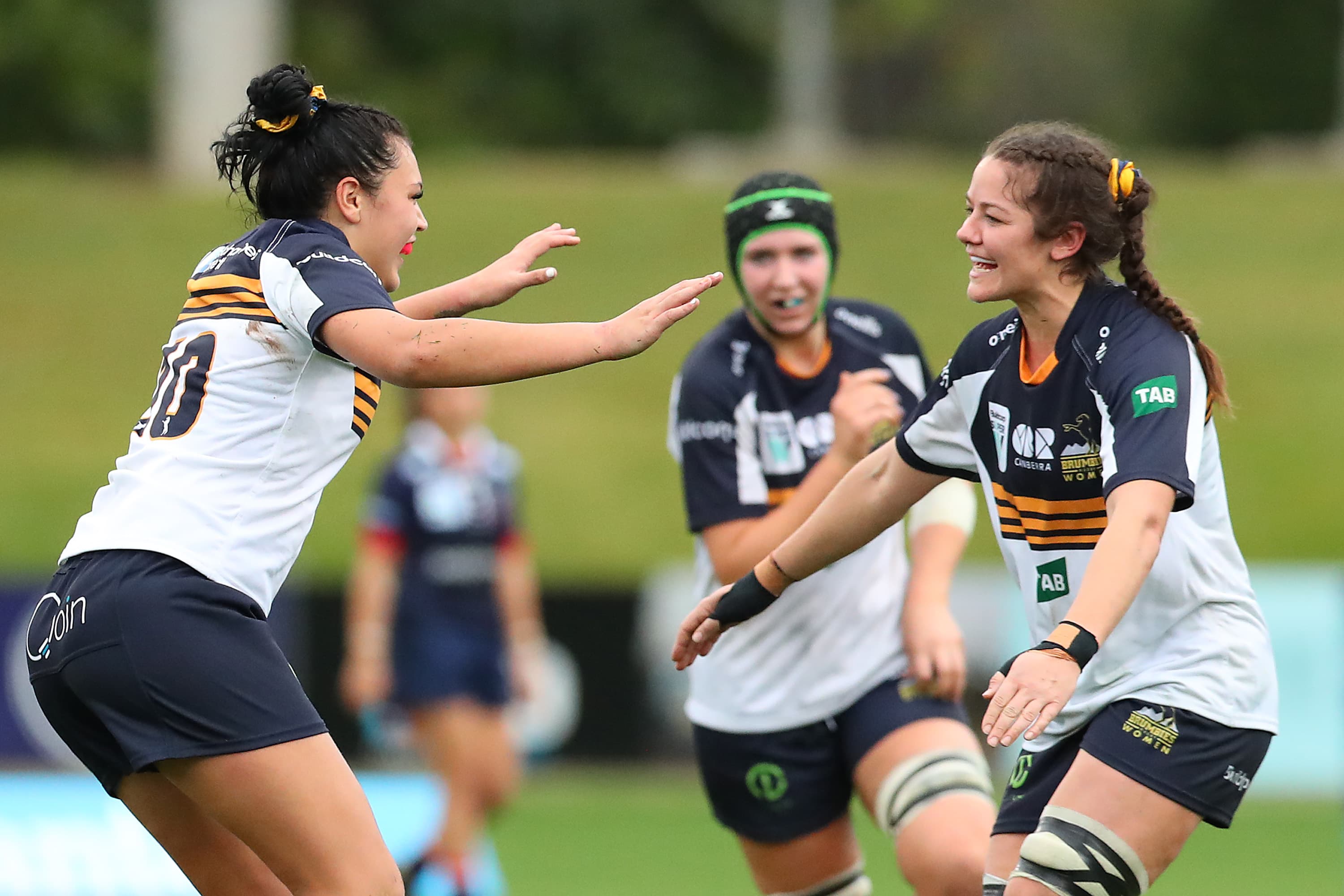 Michaela Leonard (c) of the Brumbies (R) and Teliya Heteraka of the Brumbies celebrate the win during the Super W match between the Melbourne Rebels and the ACT Brumbies at Coffs Harbour International Stadium on July 03, 2021 in Coffs Harbour, Australia. (Photo by Kelly Defina/Getty Images)