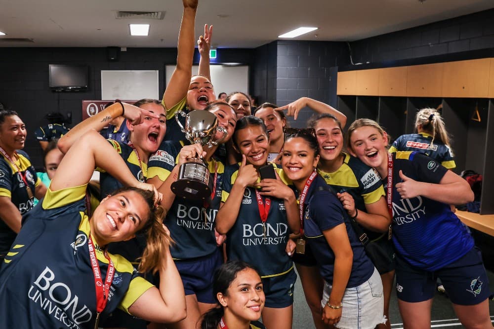 The Bond University women celebrate their first premiership in 2022. Photo: Brendan Hertel, QRU