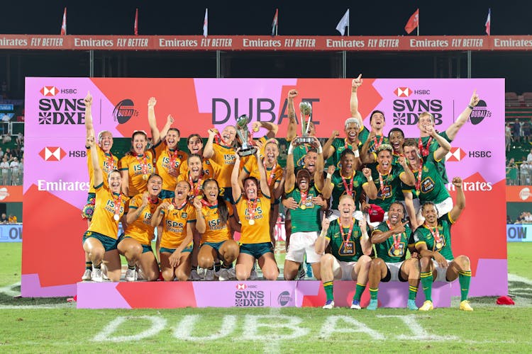 The Australians and South Africans with their respective titles. Photo: World Rugby