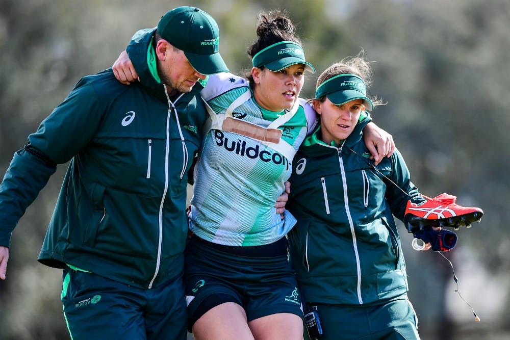 Sarah Riordan is helped from the field after a freak training accident. Photo: RUGBY.com.au/Stu Walmsley