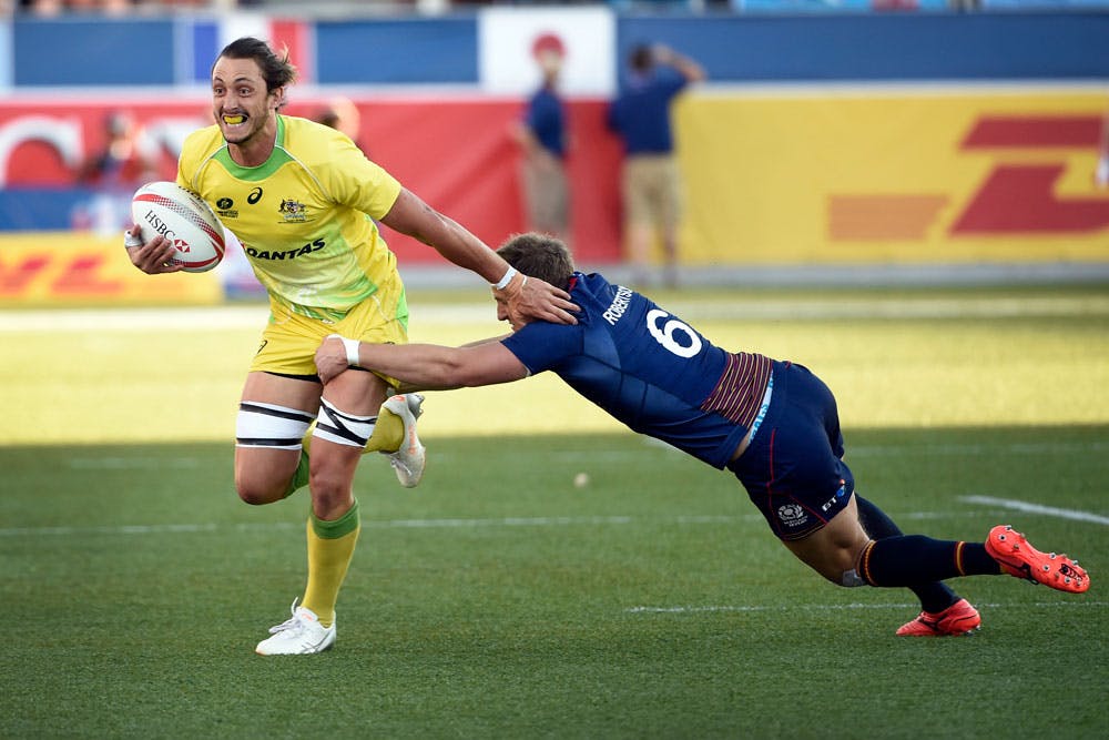 Sam Myers fights his way out of a tackle in the Las Vegas Sevens. Photo: AFP