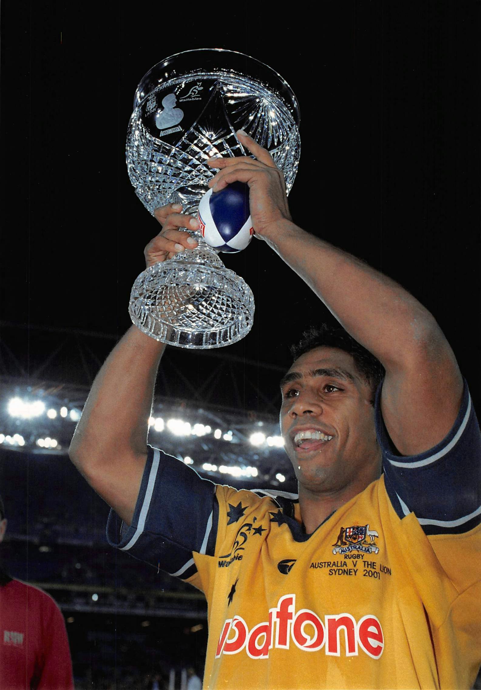 Action shot - Andrew Walker holds up the Tom Richards Cup after Australia wins 3rd Test and series v British & Irish Lions Stadium Australia
