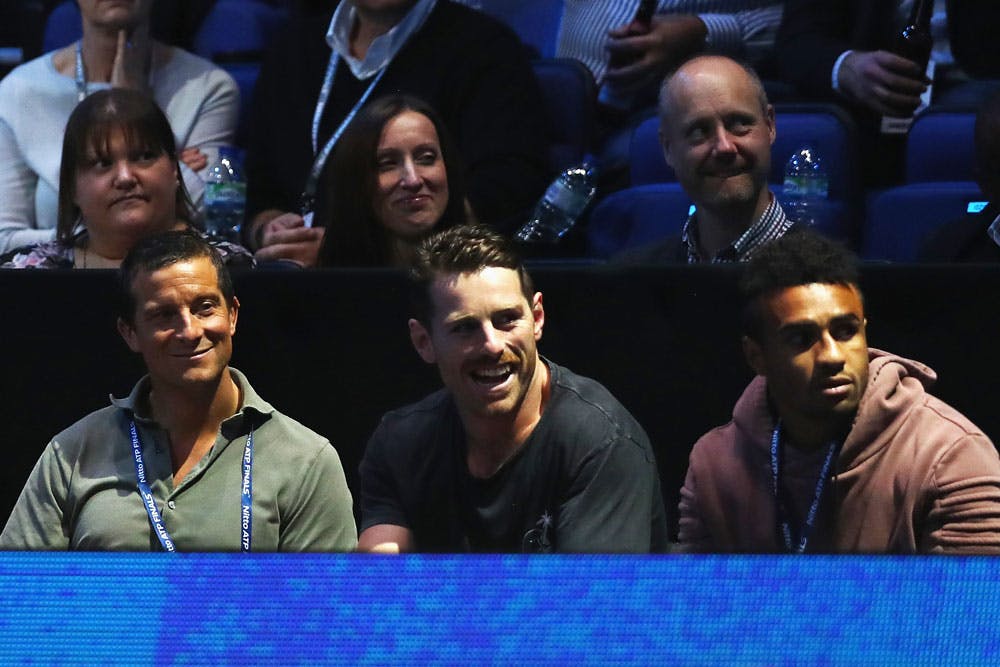 Bernard Foley and Will Genia sat next to Bear Grylls as they watched Roger Federer. Photo: Getty Images