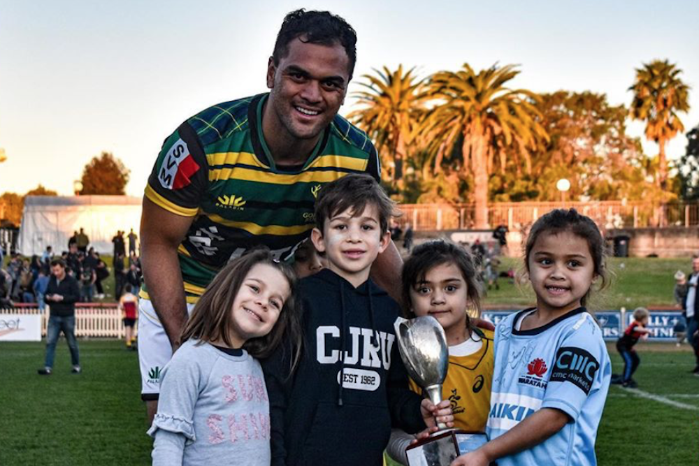 Karmichael Hunt and kids after helping Gordon beat Norths in his club debut. Photo: Lachlan Lawson Photography