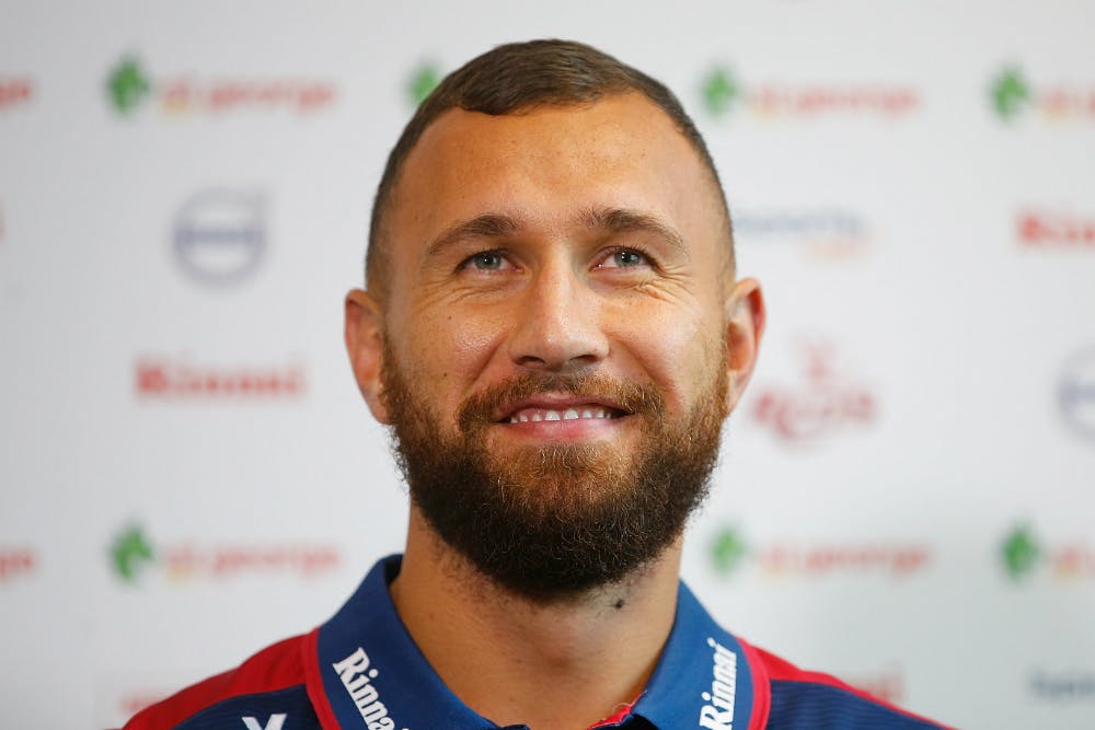 Quade Cooper smiles for the cameras at his signing announcement. Photo: Getty Images