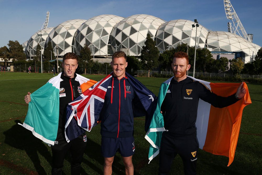 Reece Hodge and Irish AFL players Ray Connellan and Connor Glass in Melbourne on Wednesday. Photo: Getty Images