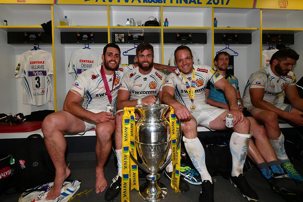Dave Dennis celebrates in the dressing rooms with Exeter teammates Geoff Parling and Kai Horstmann. Photo: Getty Images