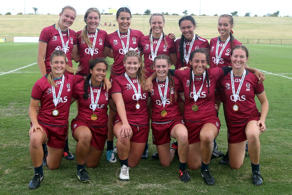 Queensland Girls team celebrate their national title after beating NSW on the Sunshine Coast. Photo: Sportography