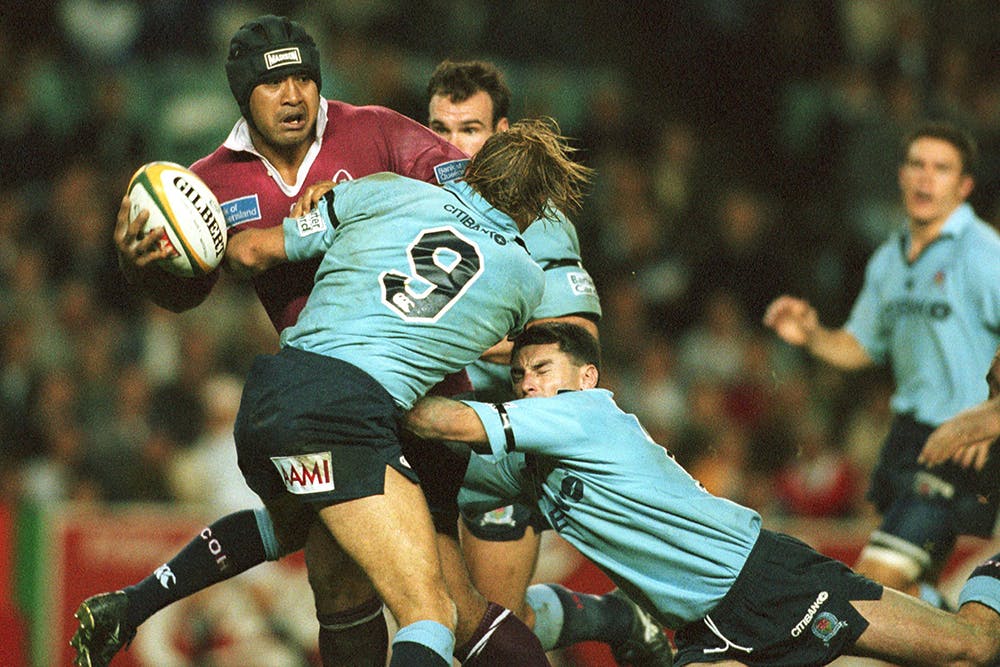 Toutai Kefu of Queensland is tackled by Duncan McRae & Chris Whitaker | Photo: Getty Images