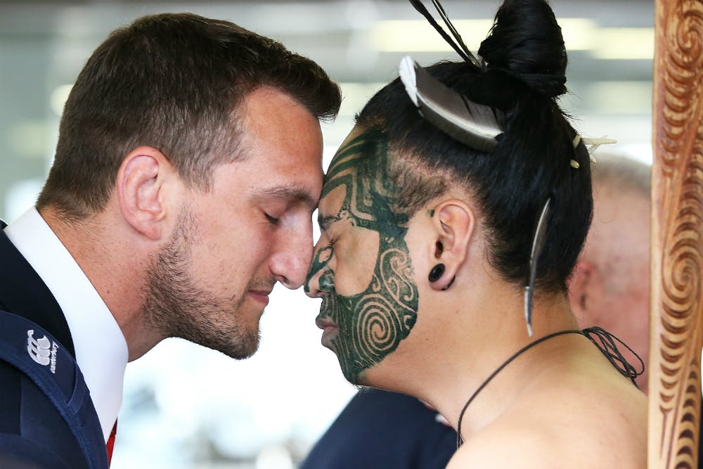 Sam Warburton shares a moment with a Maori dancer upon arrival. Photo: Getty Images