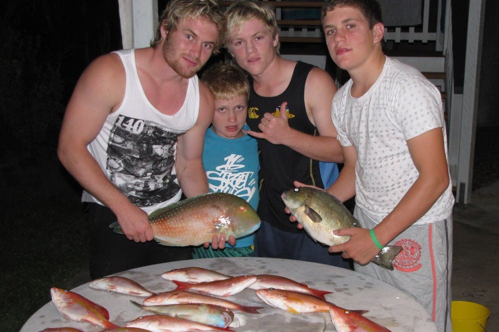 (l-r) Ben, Isaac, Matt and Tom Lucas survey their haul from a fishing trip. Photo: Lucas family
