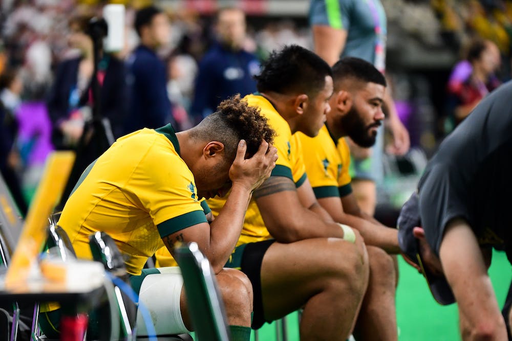 Will Genia with his head in his hands after the Wallabies were defeated in the World Cup quarter-final. Photo: Stu Walmsley/RUGBY.com.au