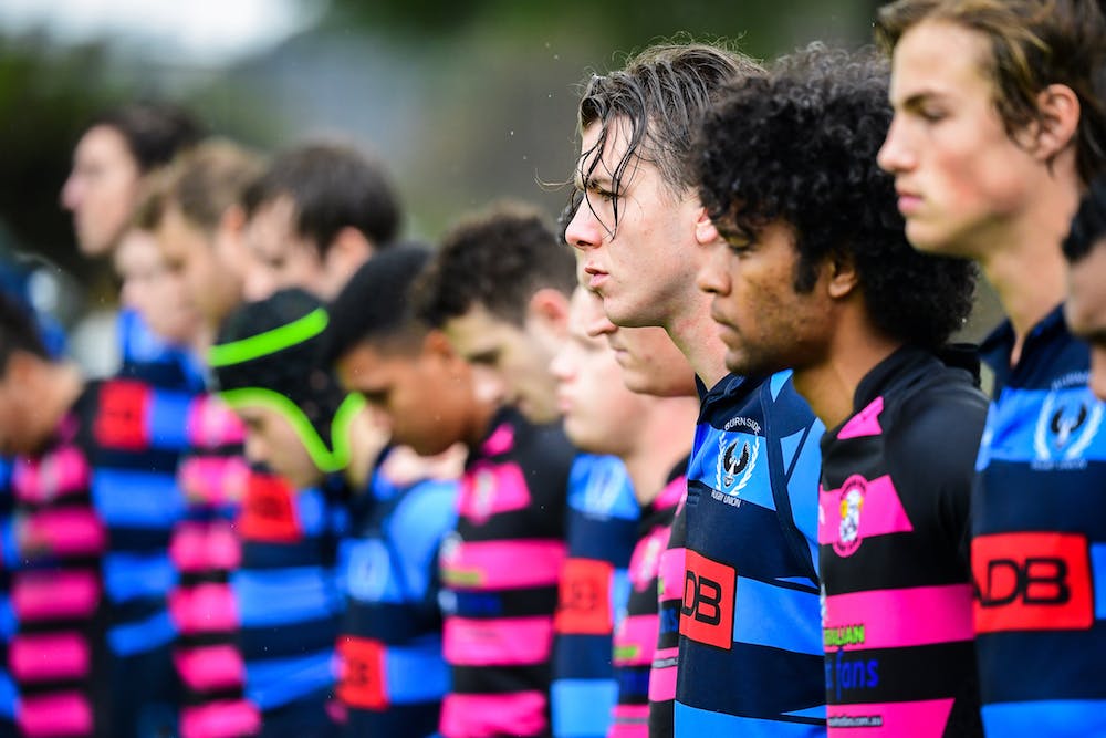 Barossa Rams and Burnside players observe a moments silence before the inaugural Kade MacDonald Shield. Photo: Rugby AU Media/Stuart Walmsley