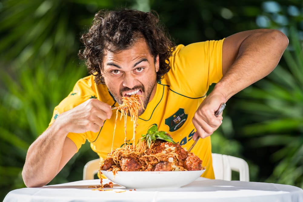Karmichael Hunt tucks into a plate of spaghetti and meatballs ahead of the Test with Italy. Photo: RUGBY.com.au/Stuart Walmsley