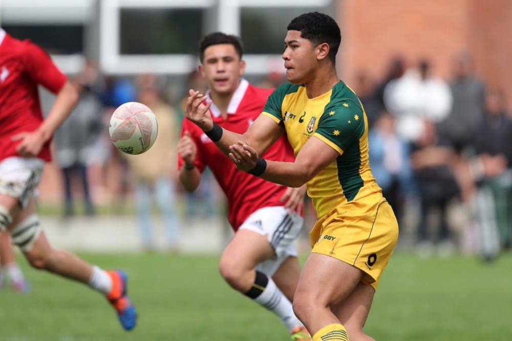 Anthony Alofipo passes in the Australian Schools and U18s win over New Zealand Barbarians. Photo: Getty Images